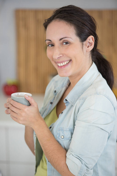 gorgeous lady drinking coffee happy - Photo, Image