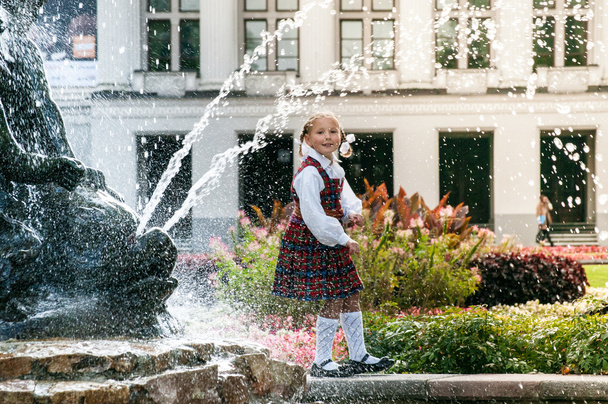 Latvian girl at a fountain - Photo, Image