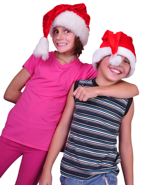 happy children with Santa Claus red hats - Fotoğraf, Görsel