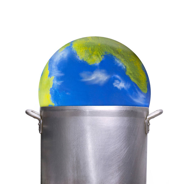 Planet earth globe inside a cooking pot on global warming concept. - Foto, Imagen