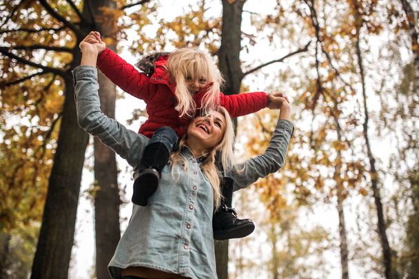 Mother with daughter in autumn park - Fotografie, Obrázek