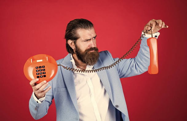 what is that. modern and vintage technology. bearded hipster use retro telephone. communication concept. brutal handsome man with moustache speak on phone. call and conversation - Fotografie, Obrázek