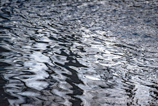 Textured waves of a mountain river with sun glare - Fotoğraf, Görsel