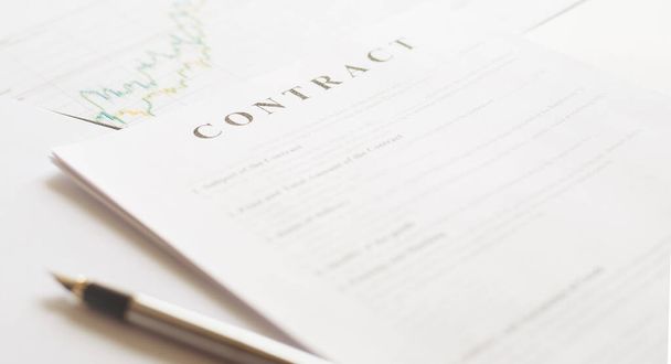 Contract paper and pen on white desk background. Focus on title Contract. Defocused pencil. - Foto, Bild