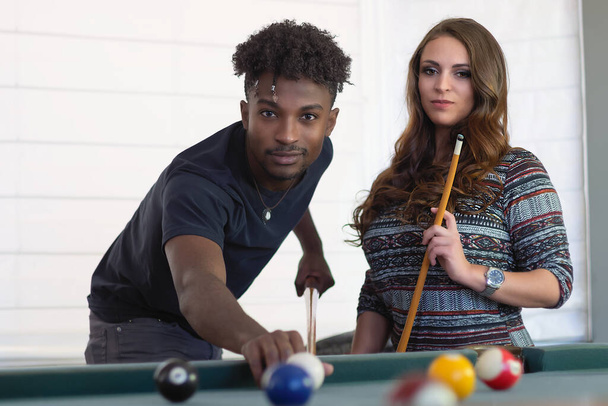 young women and men portrait team playing pool table billiards players fun activity recreation bar ball game - Фото, зображення