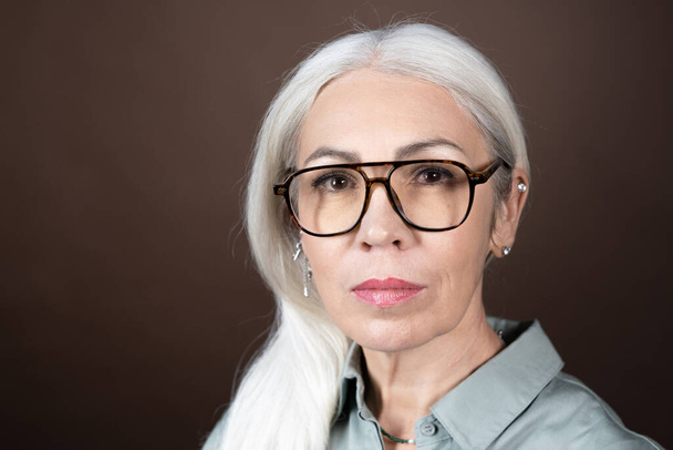 Portrait of mature woman in eyeglasses - Foto, imagen