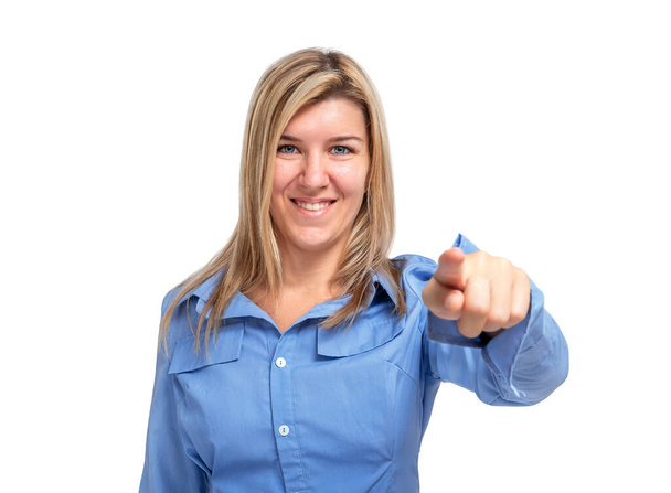 Smiling young woman pointing with index finger at camera isolated on white background - Foto, imagen