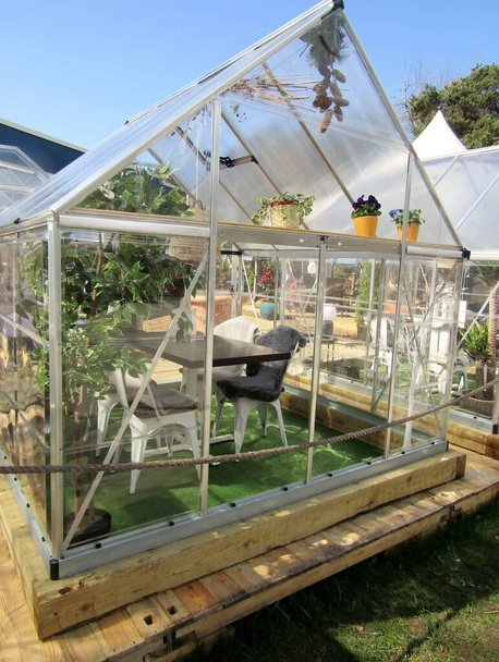 Weather-resistant greenhouses set up as outdoor dining place. Vancouver, BC, Canada. - Photo, Image