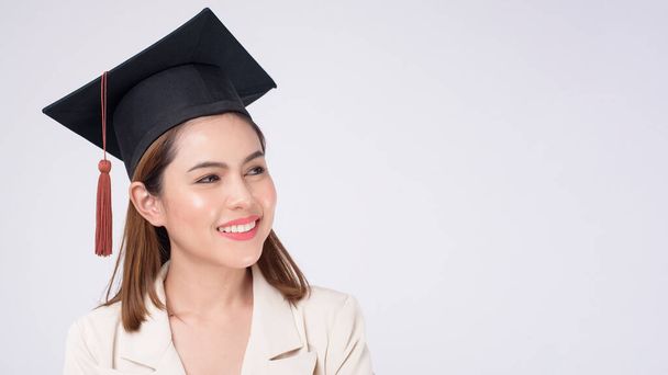 Portrait of young woman graduated over white background	 - Foto, Imagem