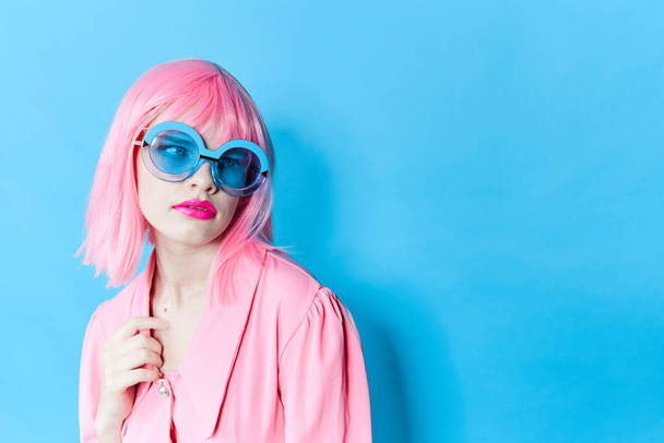 glamorous woman in pink wig pink dress Red lips isolated background - 写真・画像