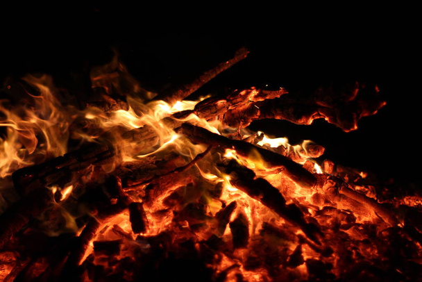 Fire. A flame on a black background. A background for designers. Colors of hell. Abstract fiery texture. - Foto, Imagen