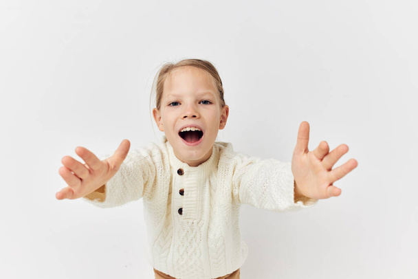 Portrait of happy smiling child girl baby clothes fashion light background - Foto, Bild