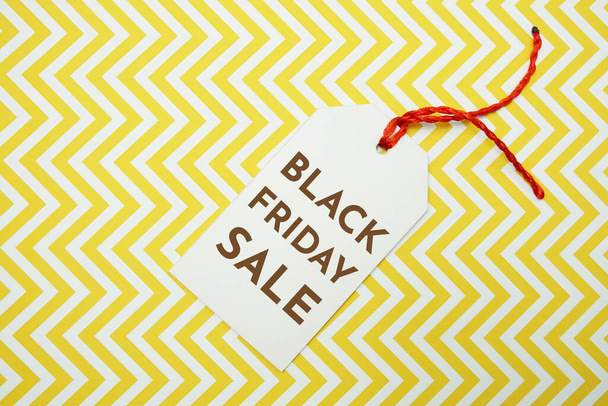Black Friday Sale tag on yellow background - Foto, afbeelding