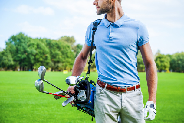 Golfer carrying golf bag - Φωτογραφία, εικόνα
