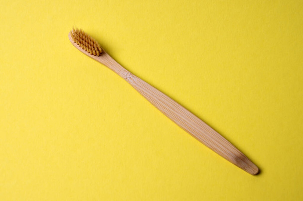 Bamboo toothbrush, top view, isolated - Фото, изображение