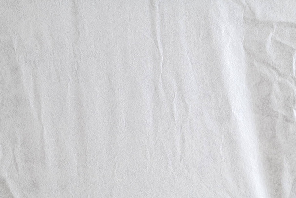 Top view of crumpled white paper. White and wrinkled texture background. - Foto, afbeelding