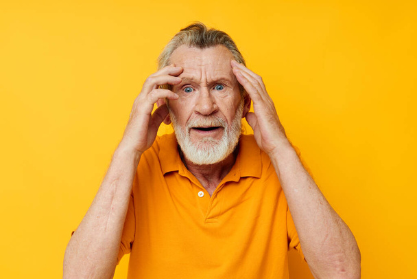 Photo of retired old man hand gesture gray beard fun monochrome shot - Фото, зображення