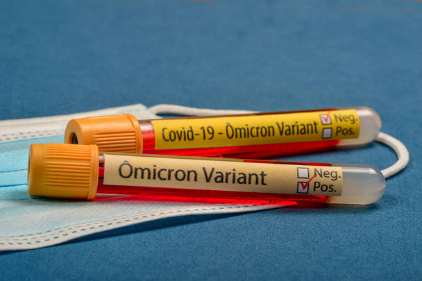 variant of covid-19 Omicron, written on blood collect tube, with various medical elements around - Fotografie, Obrázek