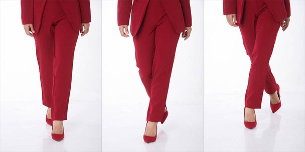 Körperteil-Schuhe asiatischer Businessfrauen der 20er Jahre tragen rote Blazer-Schuhe. Gebräunte Haut weibliche stehen zuversichtlich, gehen auf roten Schuhen für Büro-Client-Meeting über weißem Hintergrund isoliert - Foto, Bild