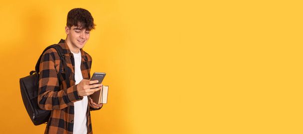 student with mobile phone isolated on background - Photo, Image