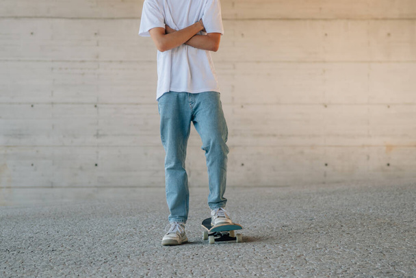 young man with skateboard with copy space - Photo, Image