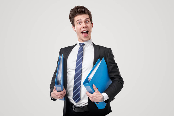 Happy accountant with folders in studio - Фото, зображення