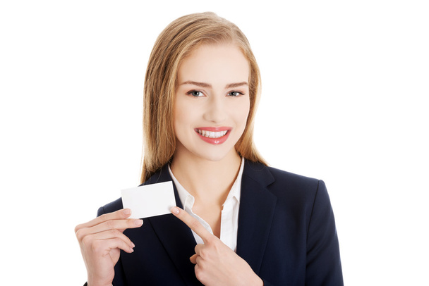 Beautiful smiling businesswoman with businesscard - Foto, imagen