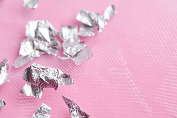 Sheets of steel foil on pink background copy space. High quality photo - Fotografie, Obrázek