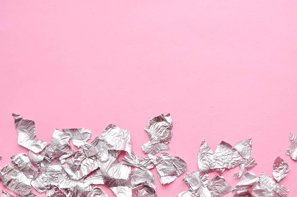 Sheets of steel foil on pink background copy space. High quality photo - Photo, Image
