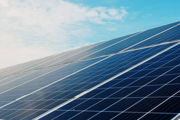 Photovoltaic power plant. Solar photovoltaic panels on blue sky background. Save the planet concept. Green energy concept. Solar energy industry - Fotoğraf, Görsel