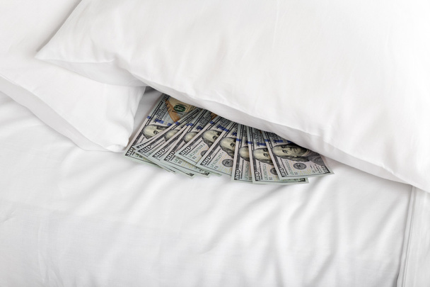 Hidden money under pillow close up - Foto, Imagen