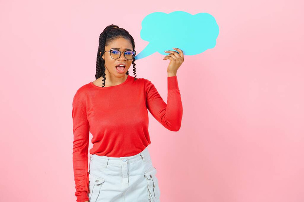 Place For Text. Happy black woman pointing at white advertisement board isolated over pink wall, copyspace - Foto, afbeelding