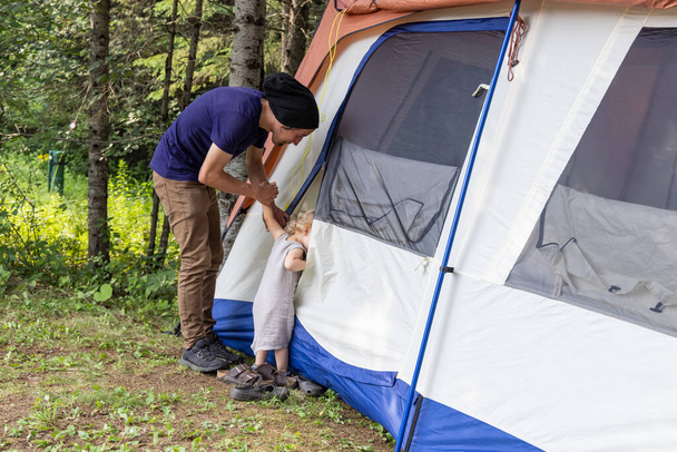 Father and son explore camping tent - Photo, Image
