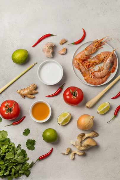 Fresh tasty ingredients for Tom Yam on a light background, pattern - Photo, image
