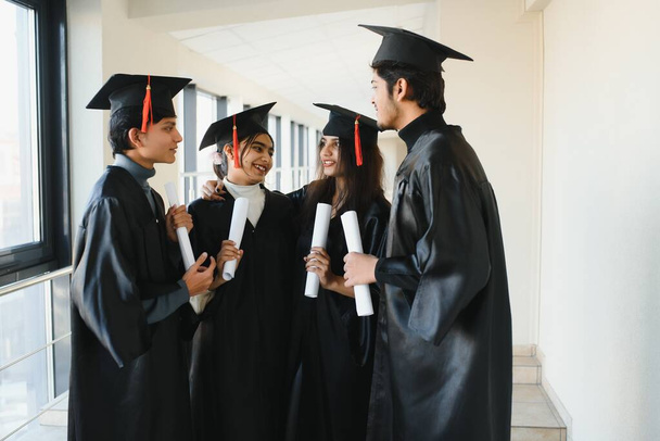 education, graduation and people concept - group of happy international students. group of Indian graduates. - Foto, Imagem