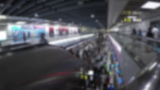 Blurred defocused timelaps of asian people travel at rush hour Subway. Timelapsed crowd of people inside the train station in Taipei, travelers take the metro for trip - Footage, Video