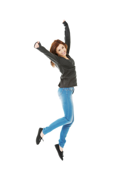 Mujer joven casual, estudiante saltando
. - Foto, Imagen