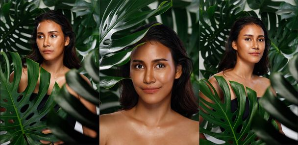 女性の顔の体は栄養新鮮なビタミンのための緑の自然に住んでいます。アジア系インド人女性は熱帯の葉の自然夏と滑らかな日焼けした肌に溶け込みます。コンセプト緑のヤシの葉自然女の子 - 写真・画像