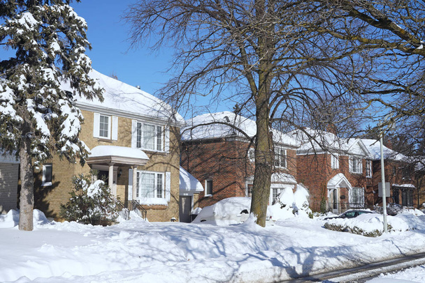 Suburban residential street on a sunny winter day after a large snowfall - Photo, Image