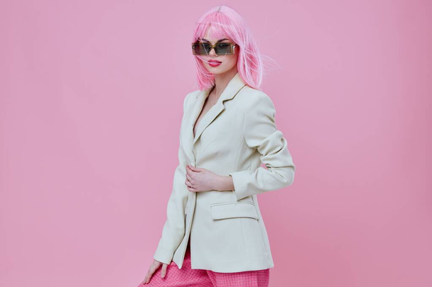 Young woman wearing sunglasses pink hair posing color background unaltered - Photo, Image