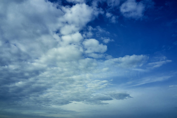 blue cloudy sky on a sunny day background screensaver backdrop. High quality photo - Photo, Image