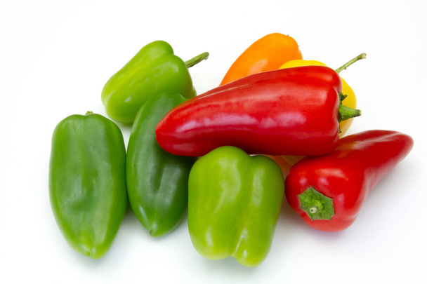 red, green and yellow peppers isolated on white background - Fotó, kép