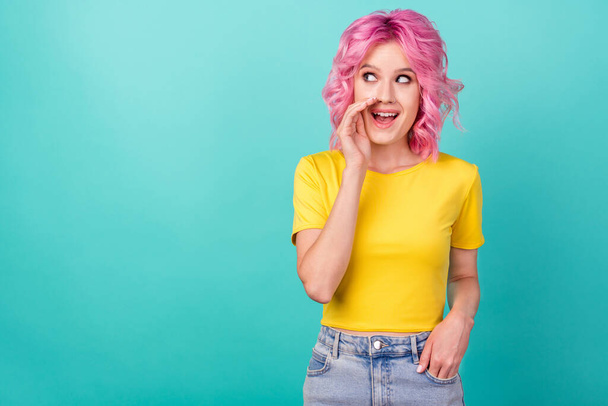 Photo of young sweet pink hairstyle lady tell secret wear yellow t-shirt isolated on teal color background - Foto, afbeelding
