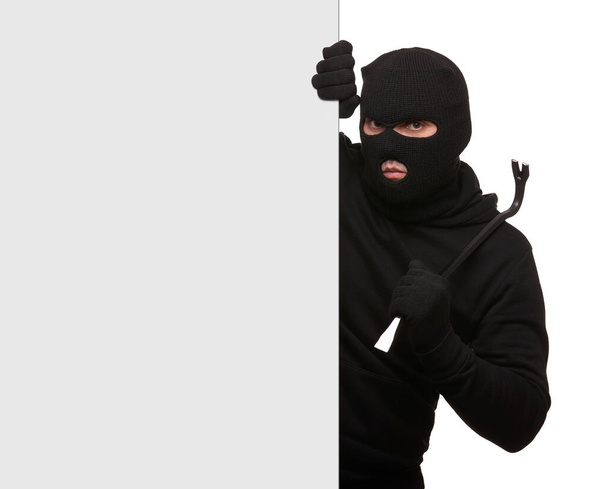 Thief in mask with crowbar on white background, free space. - Fotoğraf, Görsel
