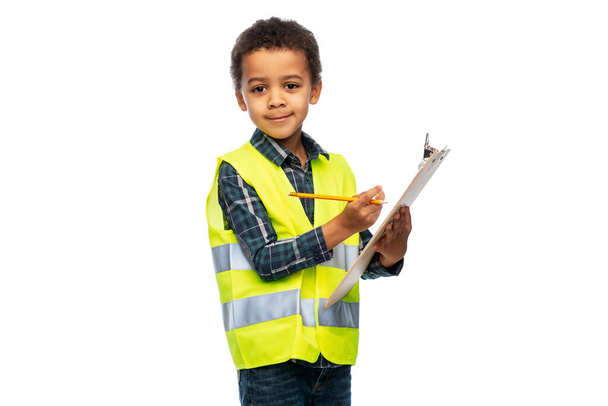 little boy in safety vest with clipboard - Fotoğraf, Görsel