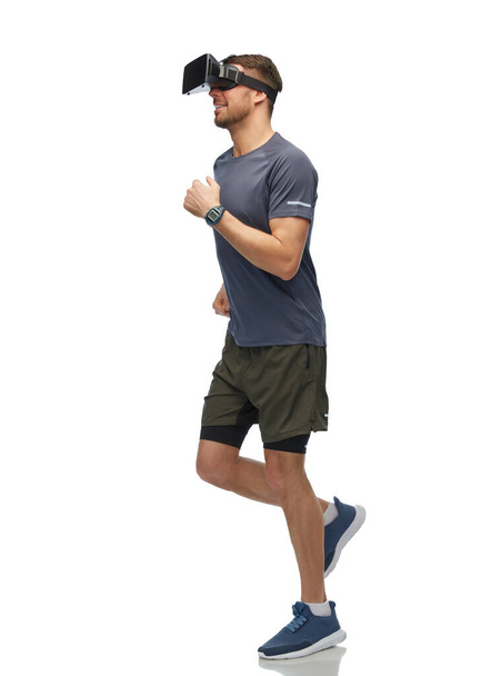 happy man in vr glasses running and training - Foto, afbeelding