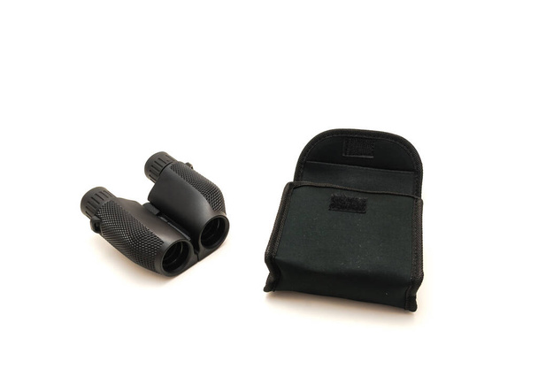 Black compact Binoculars with travel case isolated on white background. - Photo, Image