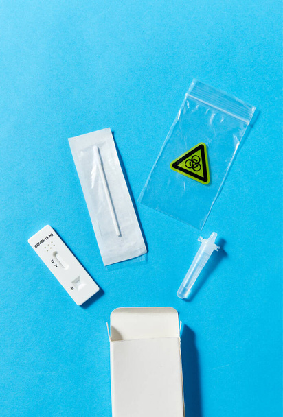 coronavirus nasal self testing kit on blue - Foto, Imagem