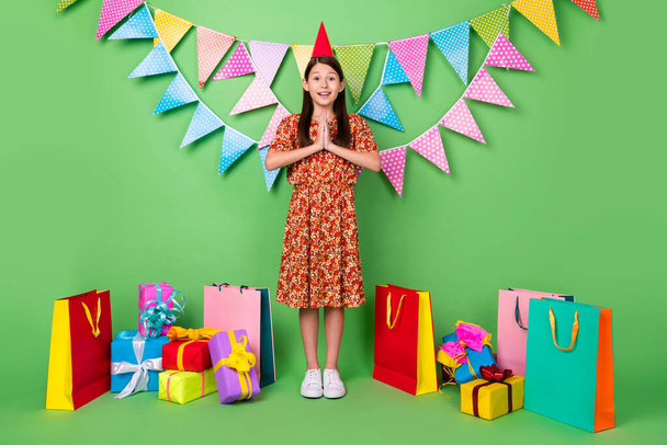 Full length body size view of attractive cheerful trendy girl festal time asking isolated on bright green color background - Fotografie, Obrázek