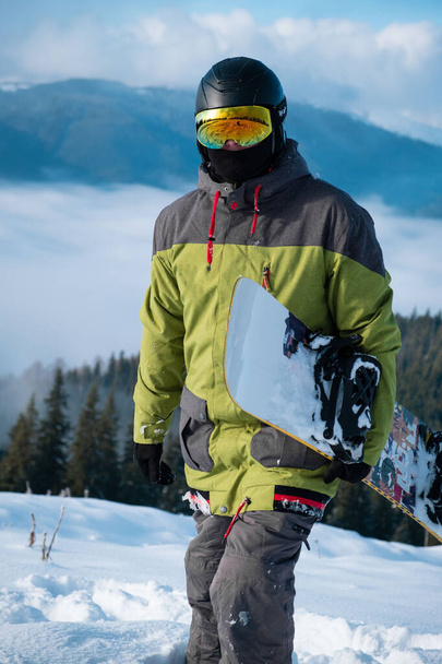 man snowboarder portrait carpathian mountains on background winter sport - Zdjęcie, obraz